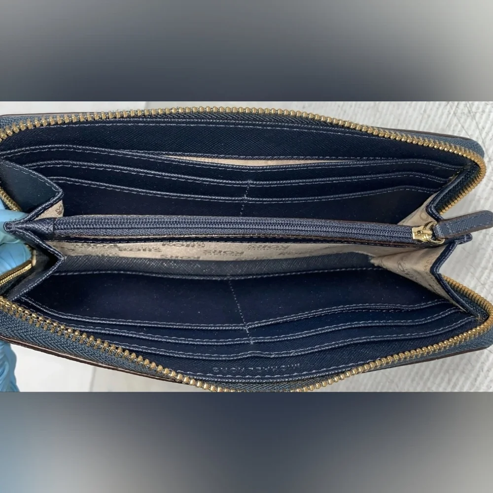 Michael Kors Blue Zip-Around Wallet with Gold Hardware.